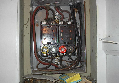 image of old, obsolete and unsafe electrical equipment found in a home